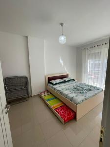 Postel nebo postele na pokoji v ubytování Nimfeum Apartments