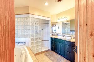 a bathroom with a bath tub and a sink at Dillon Dreamscape in Dillon +40 photos