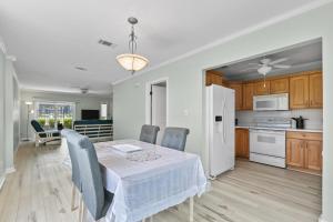 a kitchen and dining room with a table and chairs at Gulf Winds #25 in Destin
