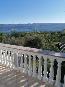a balcony with a view of the water at Four Bedrooms Villa Anita in Polje