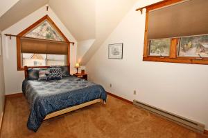 a bedroom with a bed and a window at River Park 1245 in Ouray