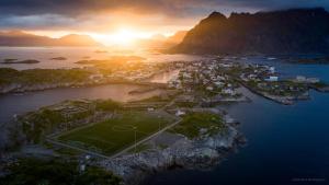 an island with a soccer field in the water at Villa Bryggekanten - by Classic Norway Hotels in Henningsvær
