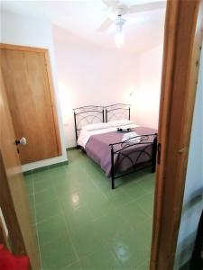 Postel nebo postele na pokoji v ubytování Maresalento Villetta Dante