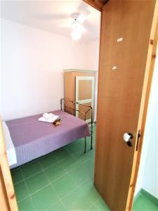 Postel nebo postele na pokoji v ubytování Maresalento Villetta Dante