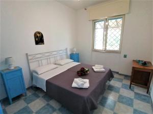 Postel nebo postele na pokoji v ubytování Maresalento Villetta Dante