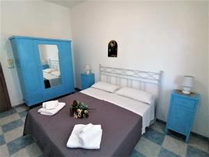 Postel nebo postele na pokoji v ubytování Maresalento Villetta Dante