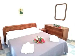 Postel nebo postele na pokoji v ubytování Maresalento Villetta Dante