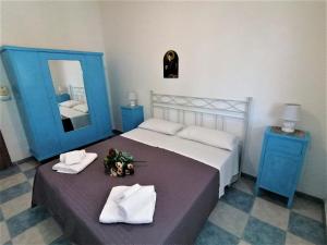 Postel nebo postele na pokoji v ubytování Maresalento Villetta Dante