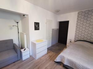 Postel nebo postele na pokoji v ubytování Apartament Ogrodowa
