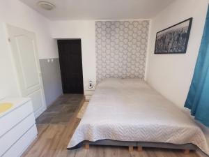 Postel nebo postele na pokoji v ubytování Apartament Ogrodowa