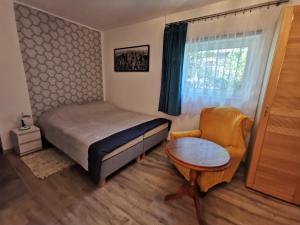 Postel nebo postele na pokoji v ubytování Apartament Ogrodowa