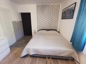 Postel nebo postele na pokoji v ubytování Apartament Ogrodowa