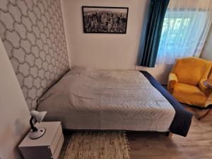 Postel nebo postele na pokoji v ubytování Apartament Ogrodowa