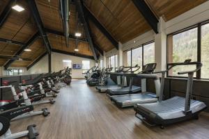 a gym with a row of treadmills and machines at Tamarron Lodge Suite 203-201 in Durango