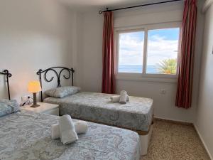 Postel nebo postele na pokoji v ubytování Acapulco Playa 412 Apartments Casasol