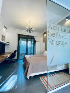 a bedroom with a bed and a desk and a mirror at Small Gem Studio Athens, next to metro nomismatokopeio in Athens