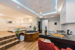 a kitchen with a tub in the middle of a room at Padam Hotel & SPA in Ulcinj