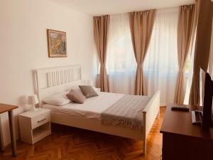 Cama o camas de una habitación en Linc Rooms & Apartments