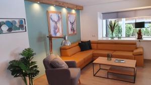 Posezení v ubytování Alpen Appartements Viehhofen near Saalbach & Zell am See - incl Sommercard