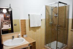 a bathroom with a sink and a shower at A due passi dal mare in Capo dʼOrlando +10 photos