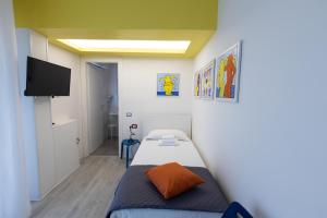 Säng eller sängar i ett rum på Valmontone Travel Rooms