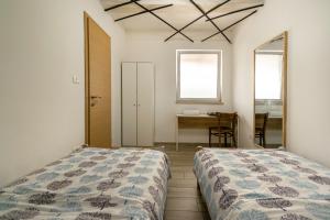 Postel nebo postele na pokoji v ubytování Hangar Apartments