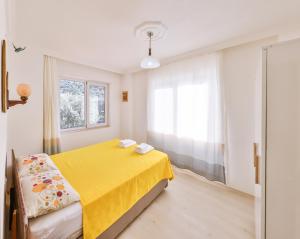 Кровать или кровати в номере Villa Candan Kaş