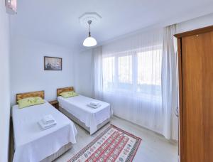 Кровать или кровати в номере Villa Candan Kaş