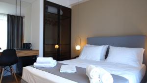 Postel nebo postele na pokoji v ubytování Valmar Hotel