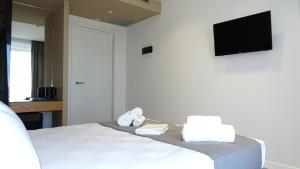 Postel nebo postele na pokoji v ubytování Valmar Hotel