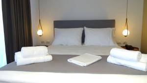 Postel nebo postele na pokoji v ubytování Valmar Hotel