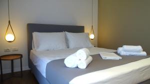 Postel nebo postele na pokoji v ubytování Valmar Hotel