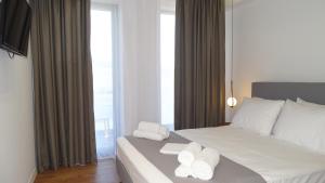 Postel nebo postele na pokoji v ubytování Valmar Hotel