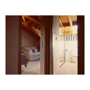 a view of a room with a bed and a glass door at Apartamentos Las Agüeras in Linares