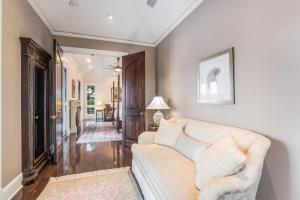 a living room with a white couch and a hallway at Sarasota Luxury Estate in Sarasota +13 photos