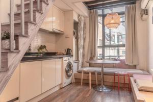 a small kitchen with a table and a window at Myeongdong Artmonstay in Seoul