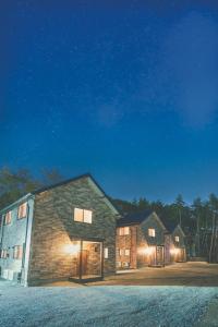 a barn at night with the lights on at Fuji Fabric stay - Vacation STAY 19980v in Fujikawaguchiko