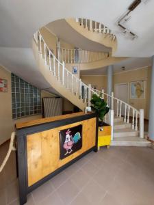 a room with a staircase and aoyer with a staircase at The Golden Rooster in Tirana