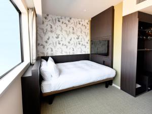 מיטה או מיטות בחדר ב-Wakoshi Tobu Hotel