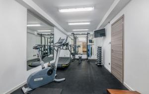 a gym with treadmills and a treadmill at Luxury Villa Ane in Malinska