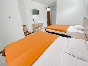 Postel nebo postele na pokoji v ubytování Ultima Syariah Cipanas Garut Mitra RedDoorz