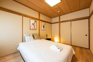 Postel nebo postele na pokoji v ubytování 寅ホテル 台東 Hotel 寅 台东 Tora Hotel Taito D