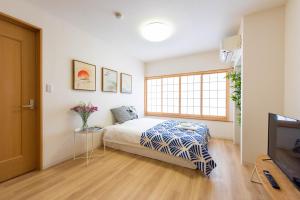 Postel nebo postele na pokoji v ubytování 寅ホテル 台東 Hotel 寅 台东 Tora Hotel Taito D