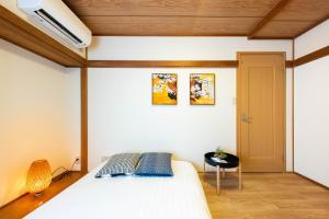 Postel nebo postele na pokoji v ubytování 寅ホテル 台東 Hotel 寅 台东 Tora Hotel Taito D