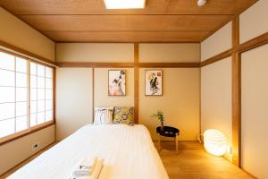 Postel nebo postele na pokoji v ubytování 寅ホテル 台東 Hotel 寅 台东 Tora Hotel Taito D