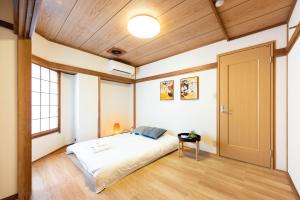 Postel nebo postele na pokoji v ubytování 寅ホテル 台東 Hotel 寅 台东 Tora Hotel Taito D
