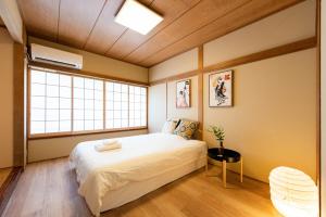 Postel nebo postele na pokoji v ubytování 寅ホテル 台東 Hotel 寅 台东 Tora Hotel Taito D