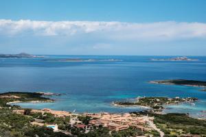 an aerial view of a resort and the ocean at Casa Valery Wonderful Sea View in Porto Rotondo