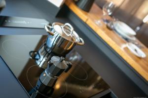 a table with a coffee pot and glasses on it at Apartment Mulino in Merano +37 photos
