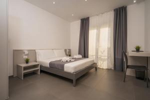 Postel nebo postele na pokoji v ubytování mc b&b